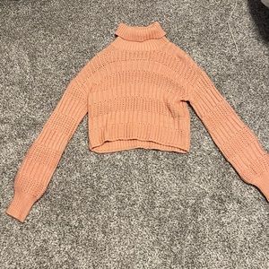 Pink cropped chunky turtleneck sweater